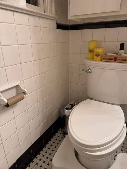 Original tiled bathroom with dated vanity before remodeling in Cayce, SC