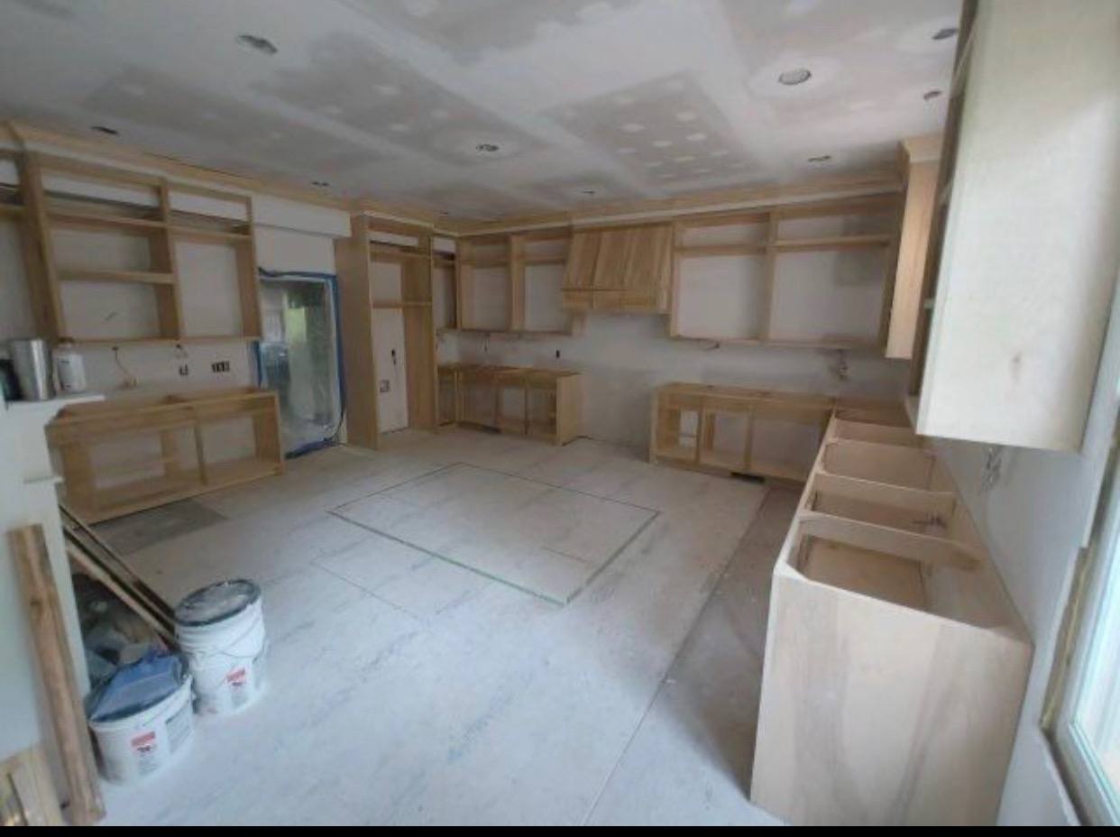 New cabinet boxes set during an interior remodel before counters and finish work