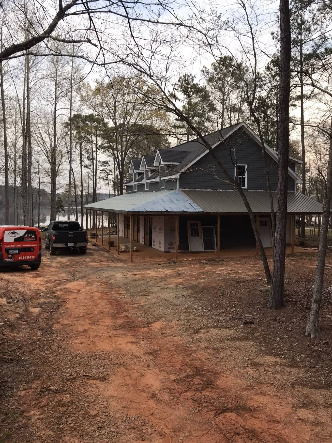 Custom home under construction with timber porch framing in Batesburg-Leesville, SC
