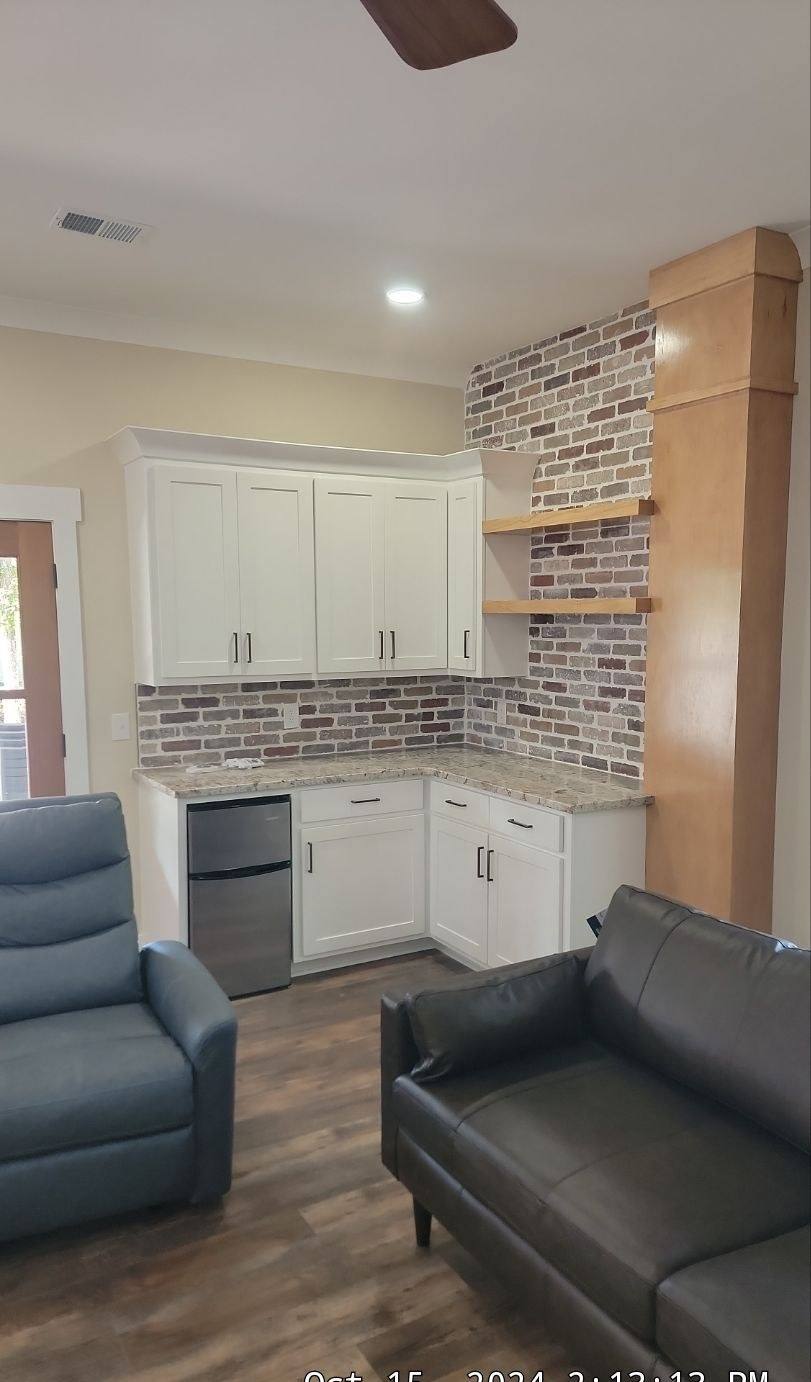 Open living area connected to the kitchen in a Batesburg-Leesville custom home
