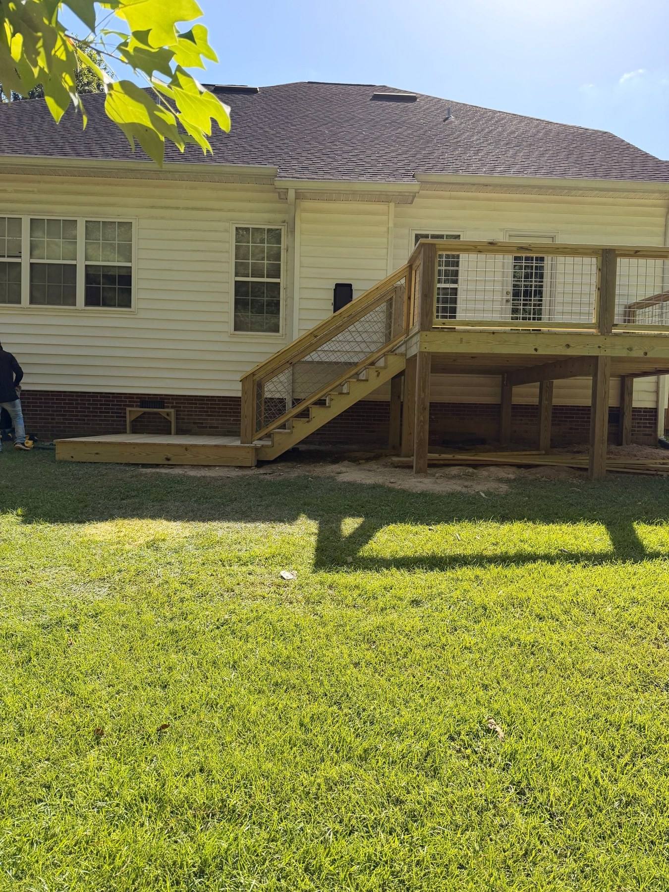 New pressure-treated deck with stairs and railings in Lexington, SC