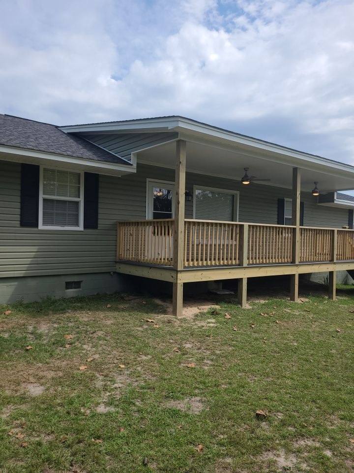 New roofed porch with composite decking and railings in West Columbia, SC