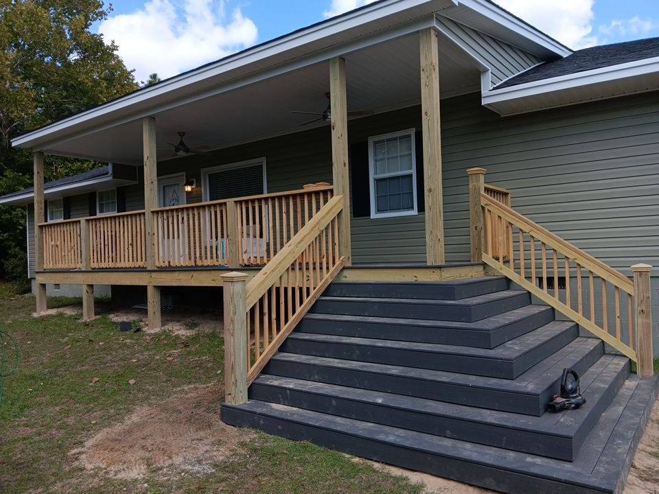 Covered porch with stairs and new siding in West Columbia, SC