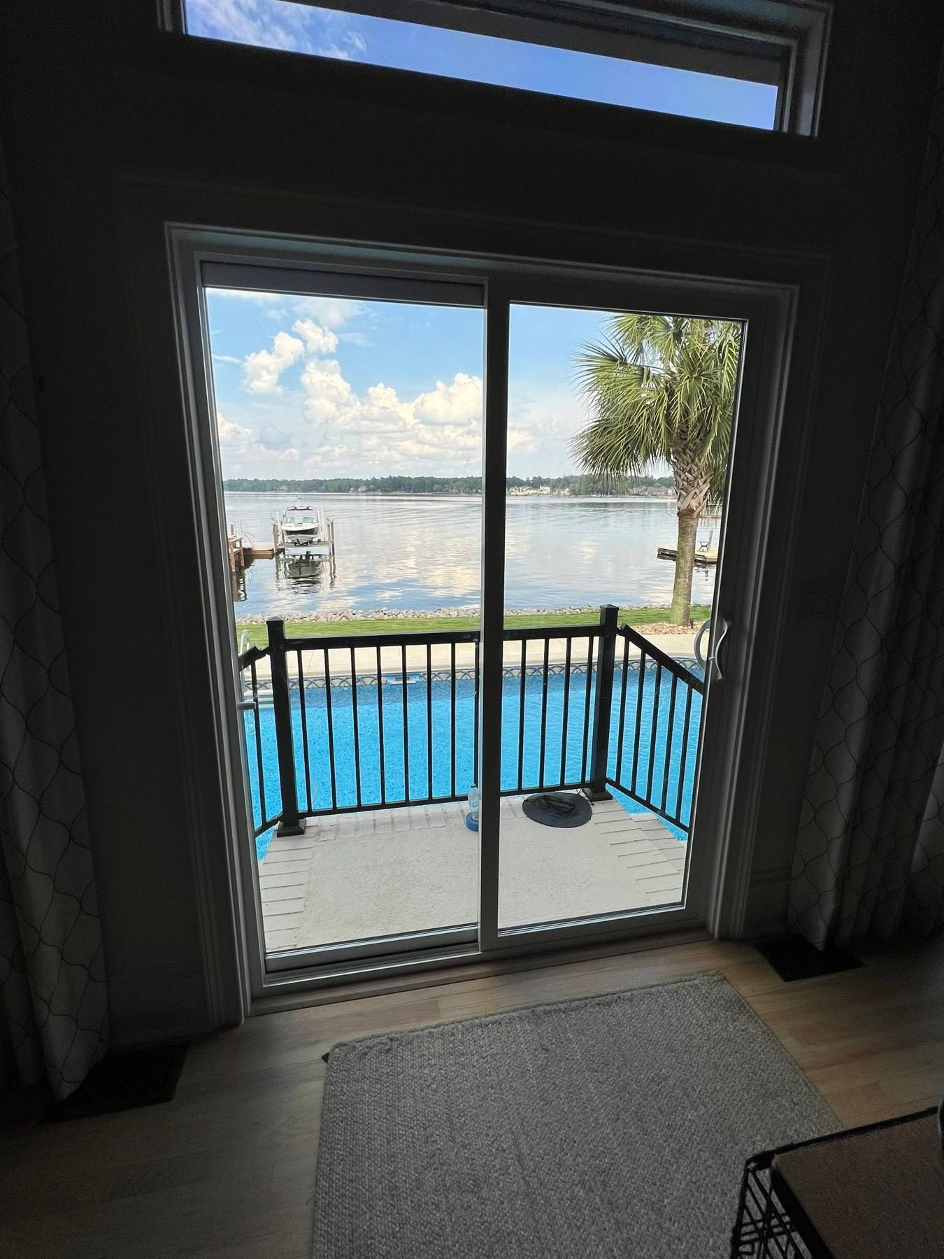 New sliding glass doors opening to a lake view in Lexington, SC