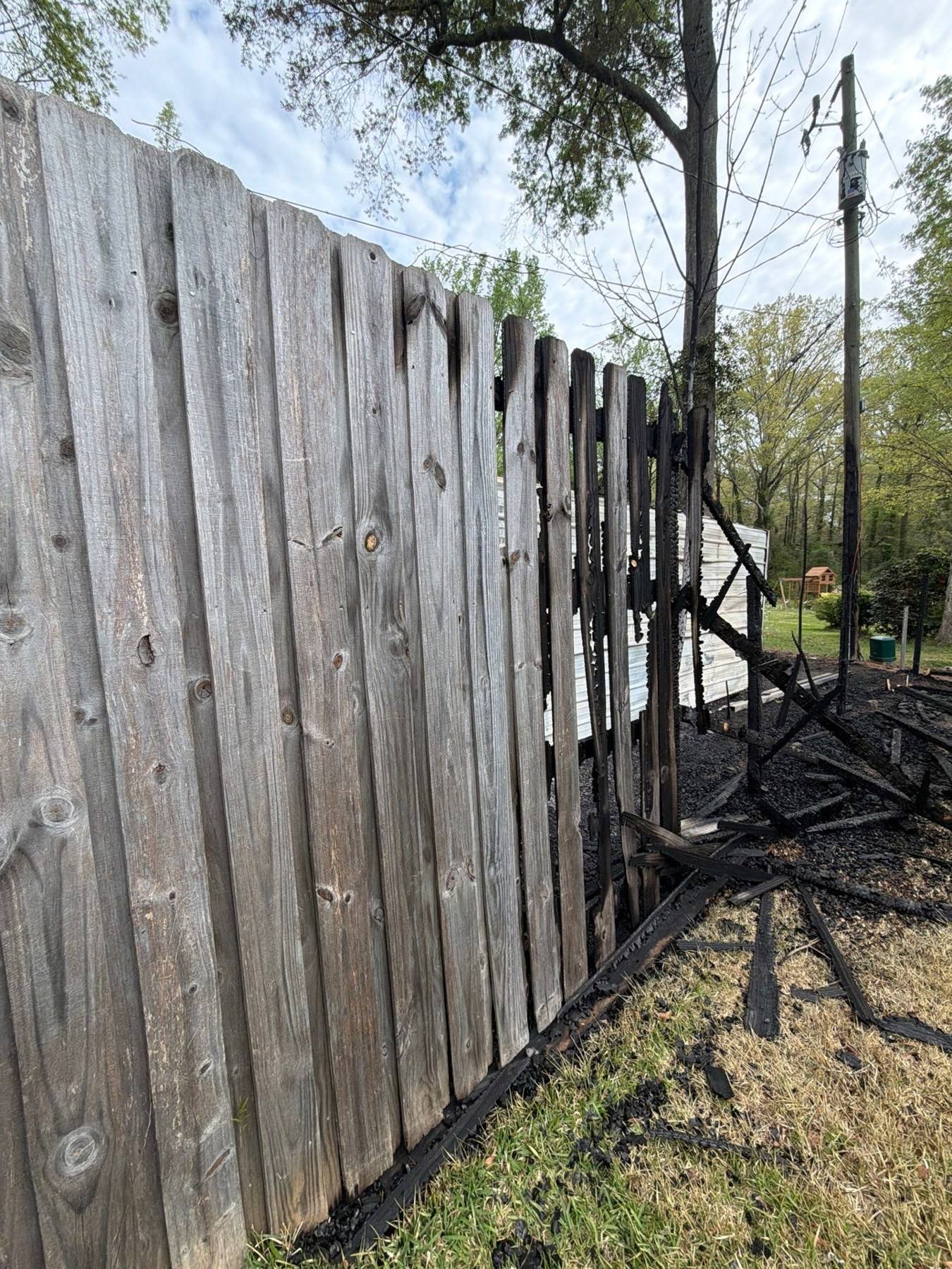 Privacy fence charred by fire damage in Columbia, SC
