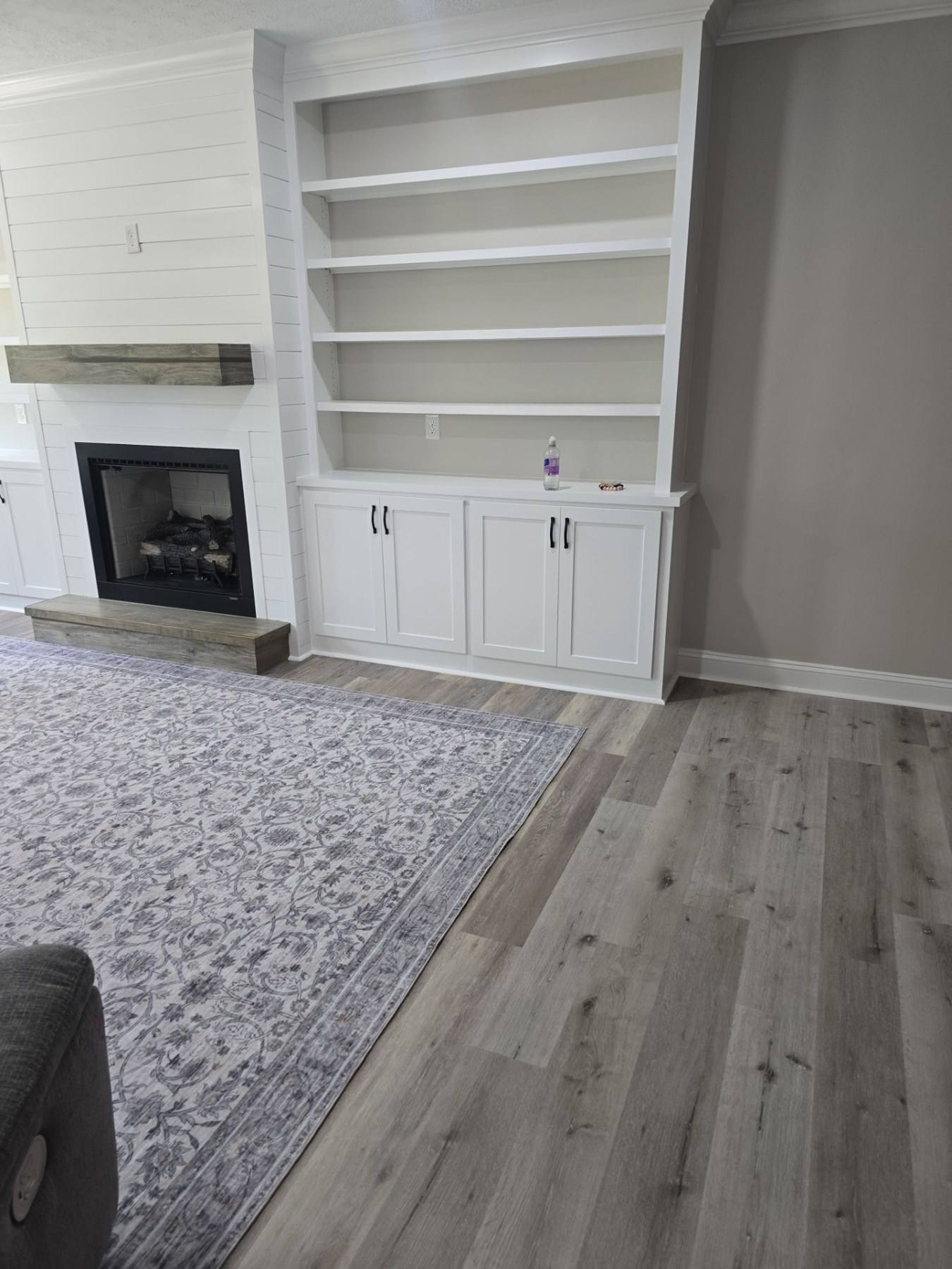 New fireplace with custom built-in shelving in a Lexington County home addition