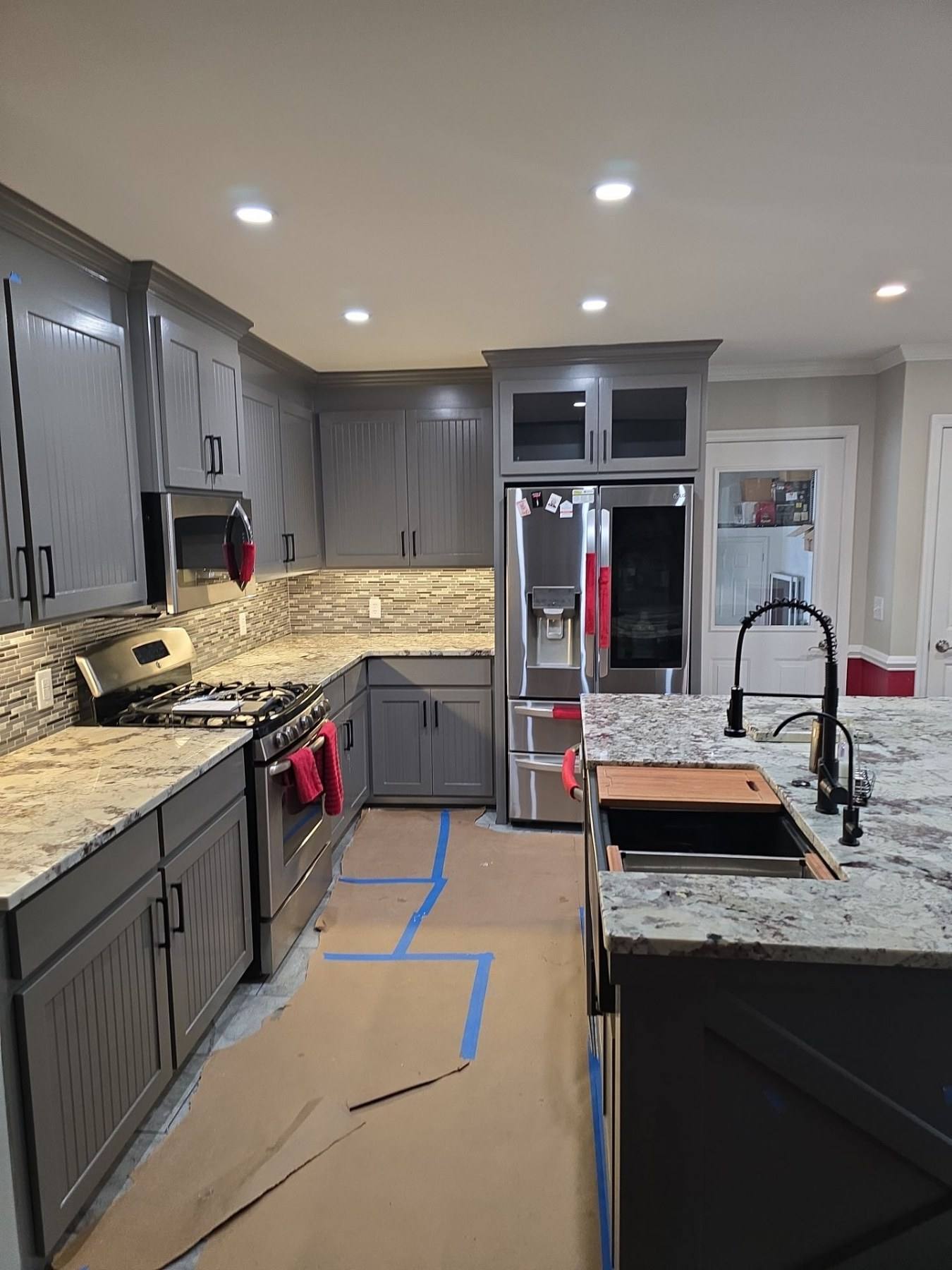 Remodeled kitchen with grey cabinets and granite counters in Gaston, SC