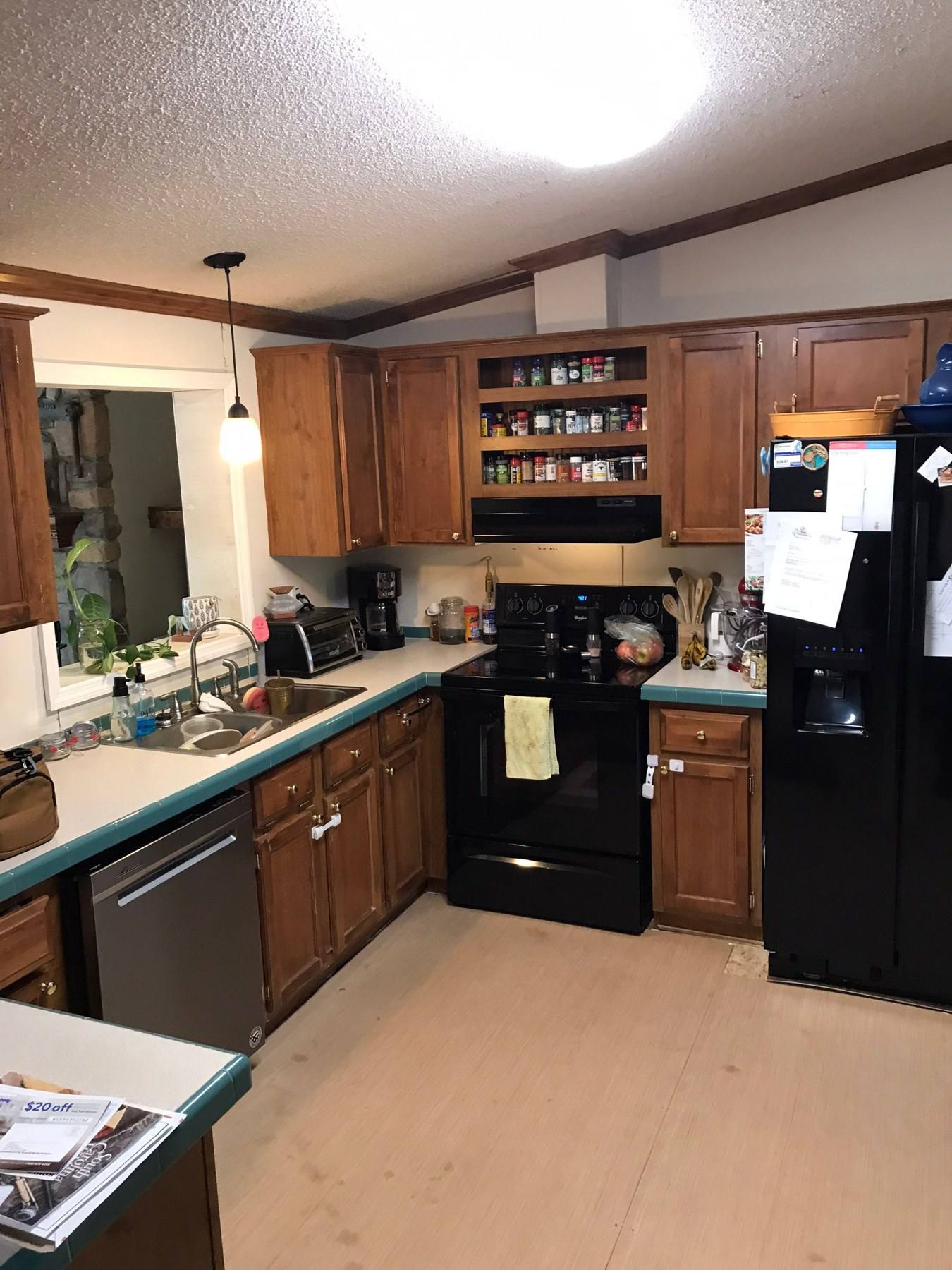 Dated oak kitchen with black appliances before remodeling in Gilbert, SC