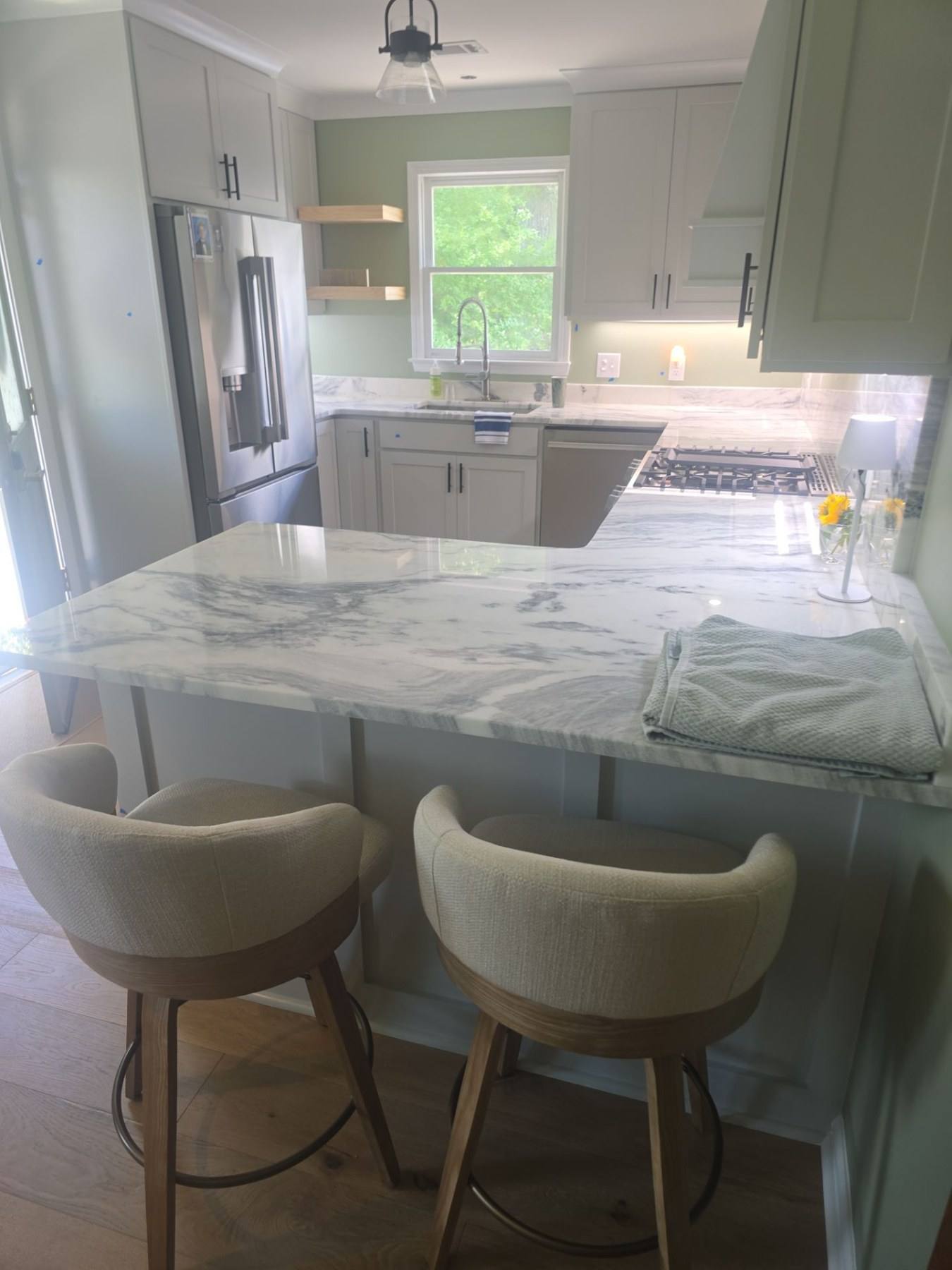 Rebuilt kitchen with marble-look island and seating in Lexington, SC