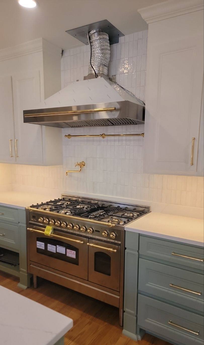 Professional range and custom hood in a rebuilt Shandon kitchen in Columbia, SC