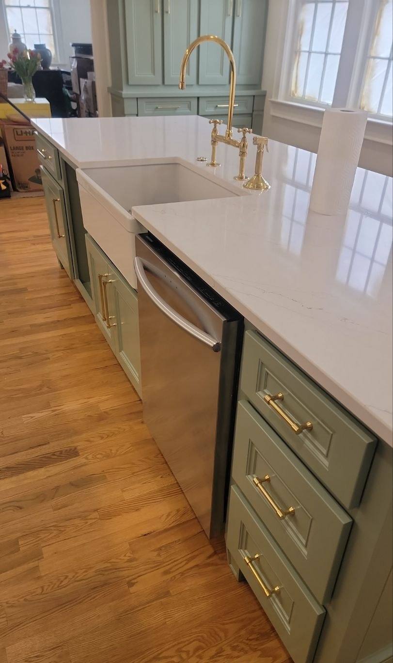 Farmhouse sink and quartz counters in a rebuilt Shandon kitchen in Columbia, SC