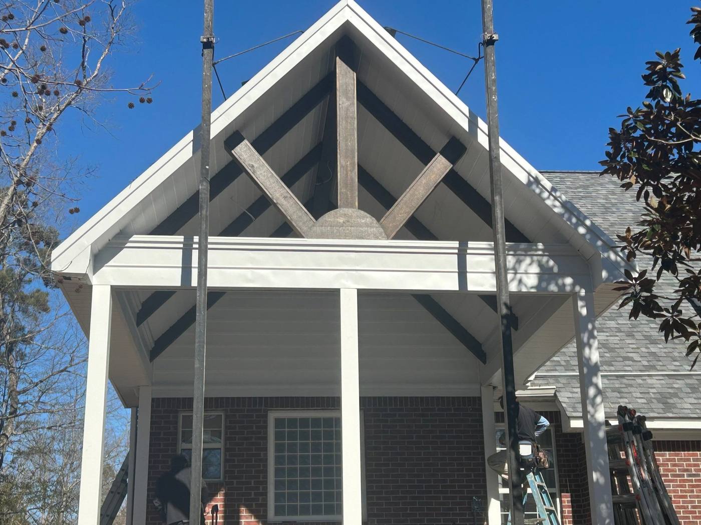 Painted gable end and exposed timber truss detail on a new porch in Lexington, SC