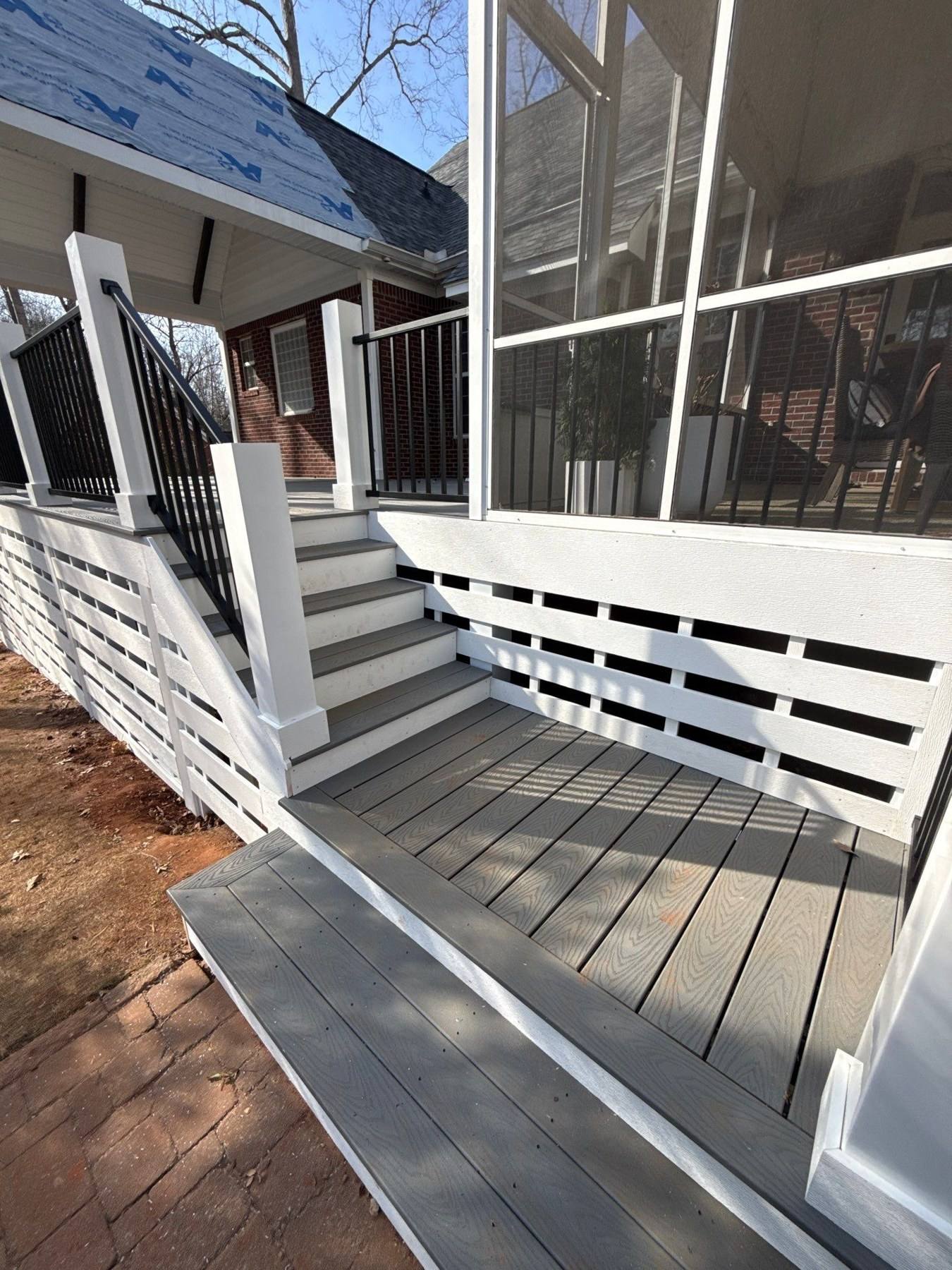New composite stairs and railing on a rebuilt screened porch in Lexington, SC