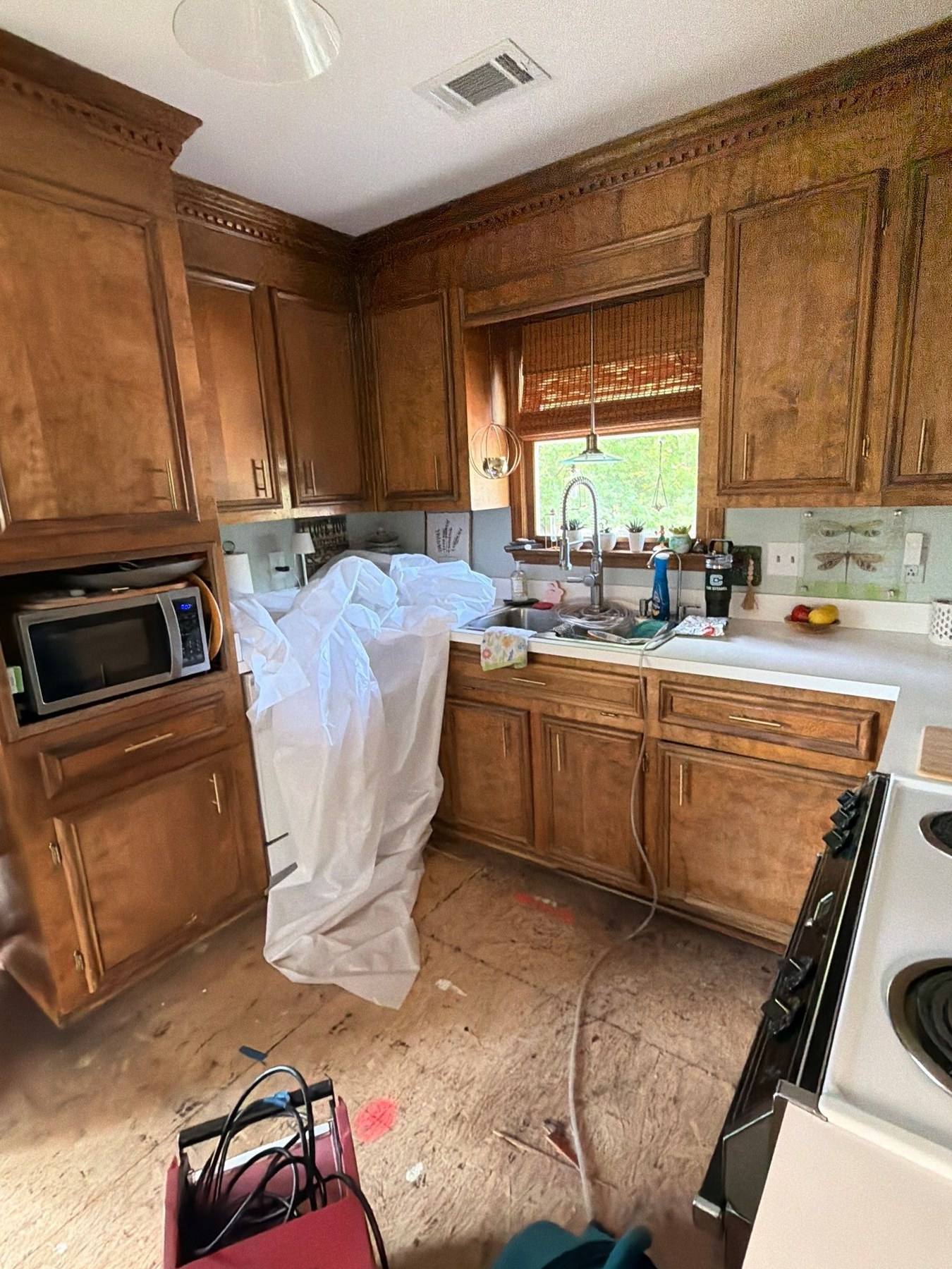 Dated oak kitchen during water damage mitigation in Lexington, SC