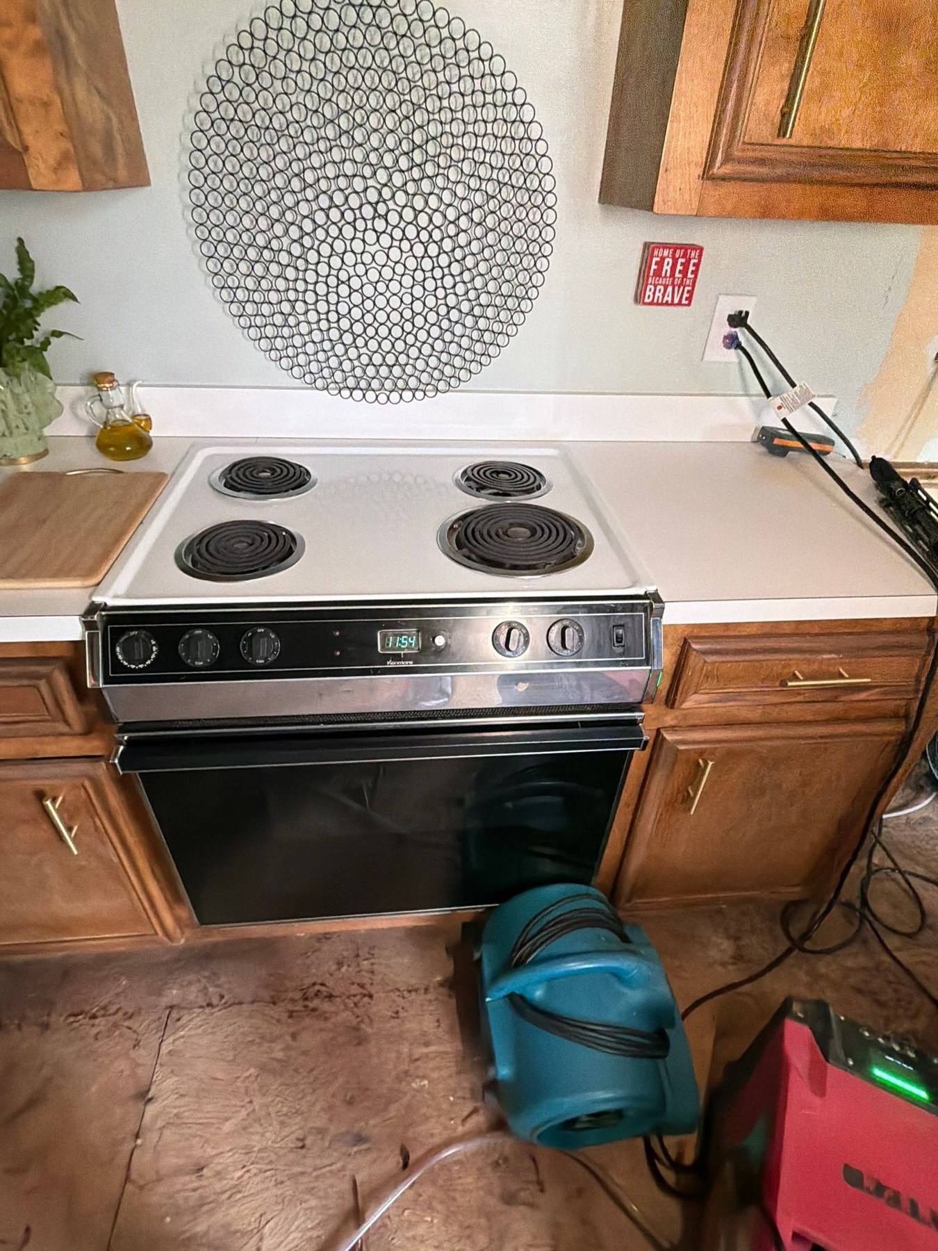 Drying equipment running in a Lexington kitchen after a water loss