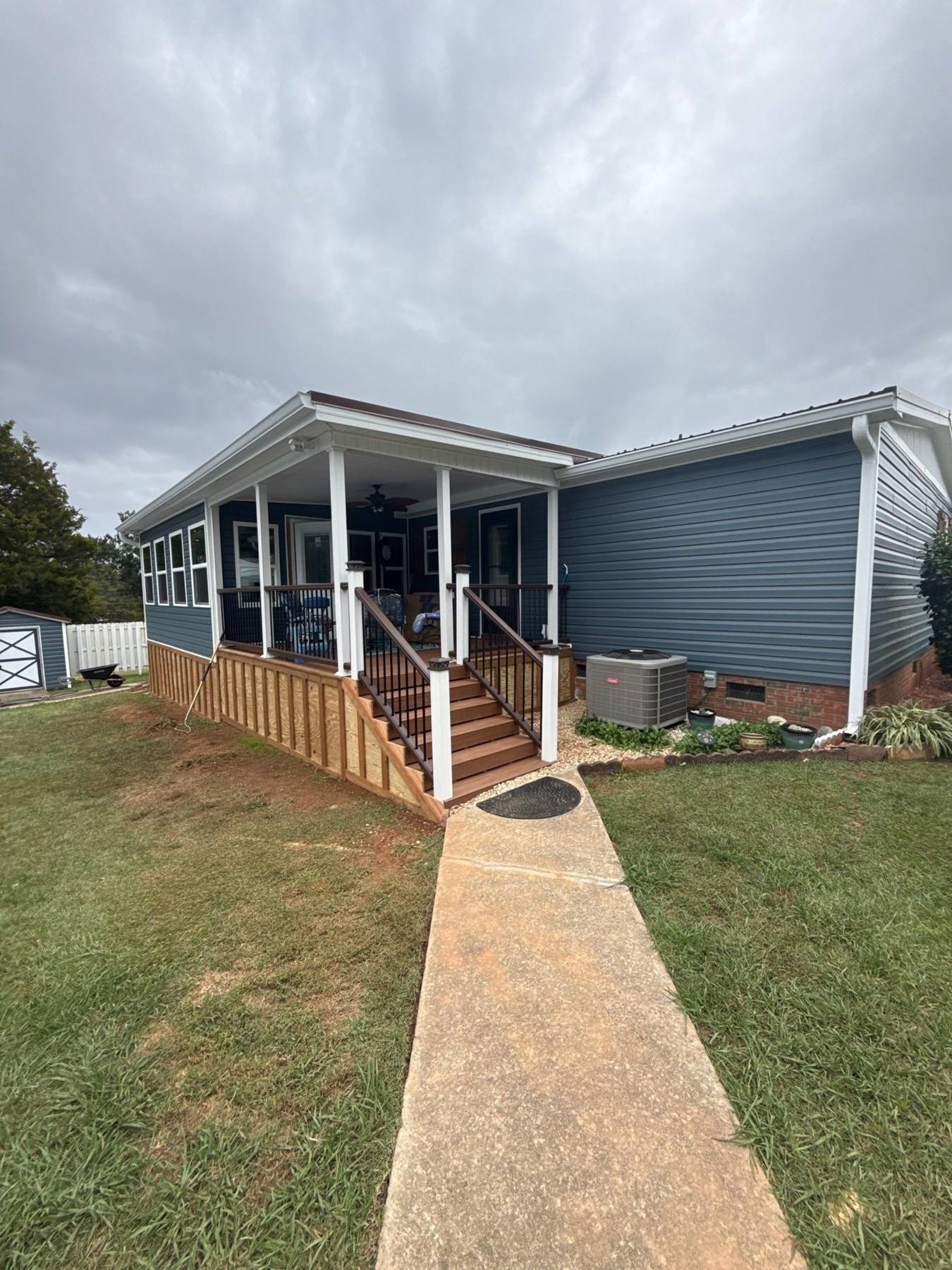 Same home after new siding, windows, a rebuilt deck and new entry in Prosperity, SC